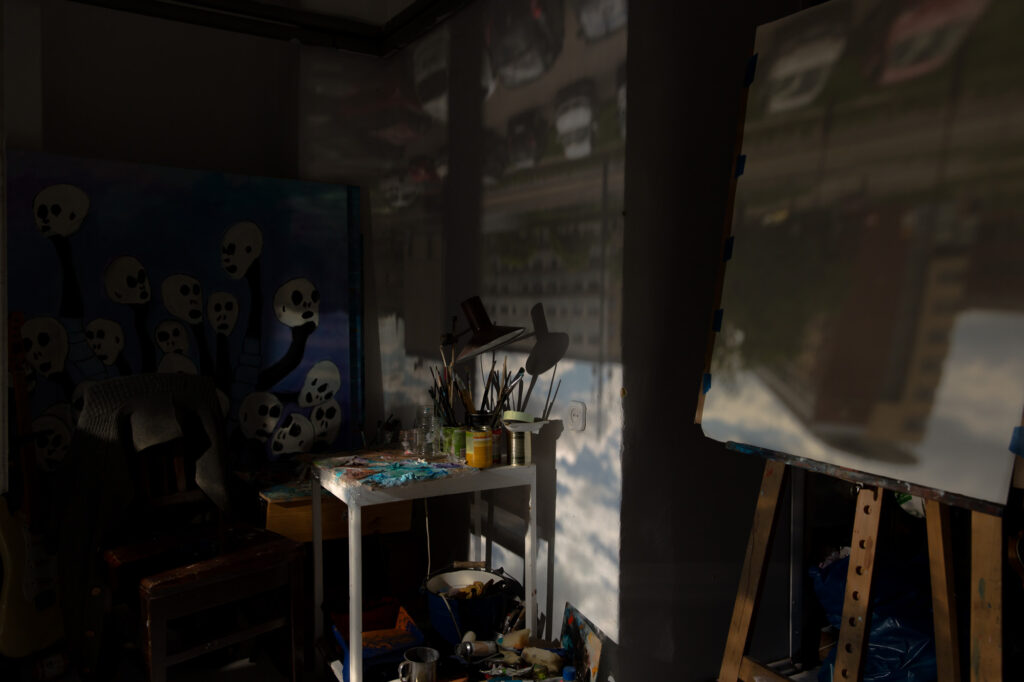 Interior of the former Salt Storage in Krakow with a camera obscura projection of the street cast onto a wall and canvas.