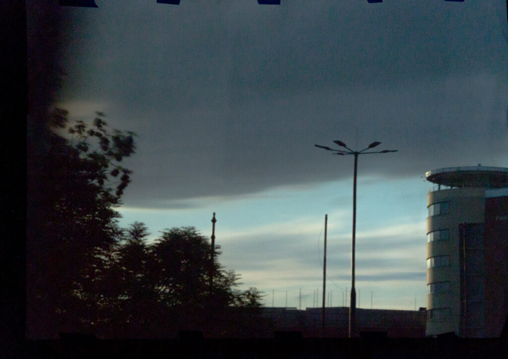Rooftop, trees and contemporary facades of Podgórze district projected indoors using camera obscura in Krakow.