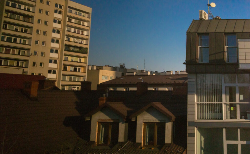 Rooftops and contemporary facades of old Podgórze district projected indoors using camera obscura in Krakow.